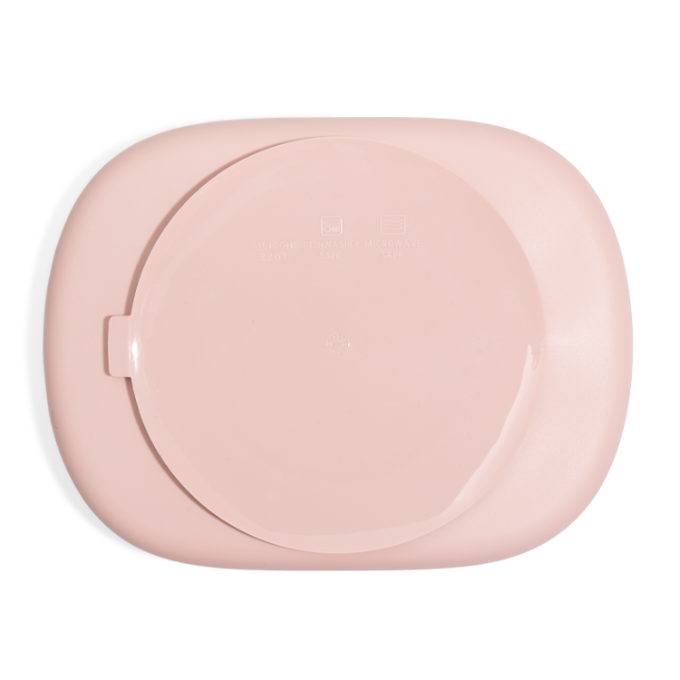 Lichtroze ontbijt verdeelbord met zuignap en deksel. De sterke zuignap zorgt ervoor dat het stevig op de tafel blijft plakken. 